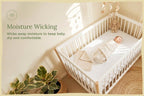 Baby crib sheets in soft white organic cotton on crib mattress