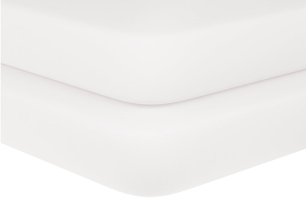 "Baby crib sheets in soft white organic cotton on crib mattress, Elasticized corner of organic baby crib sheet fitted to mattress
