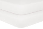 "Baby crib sheets in soft white organic cotton on crib mattress, Elasticized corner of organic baby crib sheet fitted to mattress